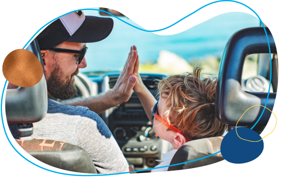 Dad and son high-five after getting a car loan.